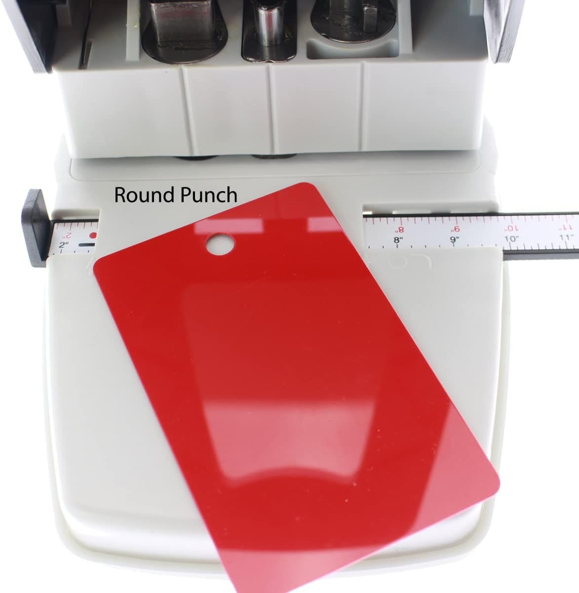 A 3-in-1 ID Card Slot Punch w/ 1 hole Punch and Corner Rounder features a red plastic card that has a round hole punched at the top, perfect for ID cards.