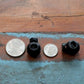 Three Adjustable Cord Lock - Round Ball Style - Single Hole End Toggle for DIY Projects (2135-4001) are placed between a quarter and a dime on a wooden surface.