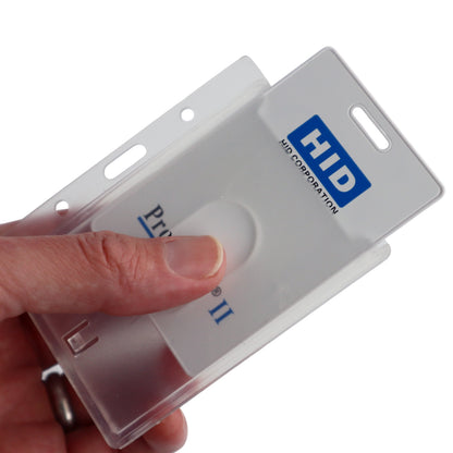 A hand holds a Horizontal 70 - 90 Mil ProxCard II / Thick HID Proximity Card Holder (SPID-PROX-H) containing a Thick Proximity Card.