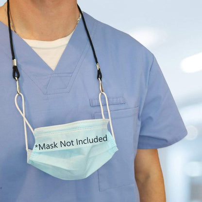 A person wearing blue scrubs has a surgical mask hanging from an Adjustable Length Double Ended Lanyard - Handy & Convenient Event Badge Holder & Hanger with 2 Clips around their neck. The mask has text printed on it that says, "*Mask Not Included.