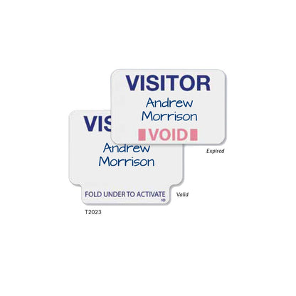 Two visitor badges labeled "Andrew Morrison." The front badge is marked "VOID" indicating it is expired, while the back badge is a Visitor Manual ONEstep Quick Tab TimeBadge, Box of 500 (P/N T2023) with an instruction to "FOLD UNDER TO ACTIVATE.