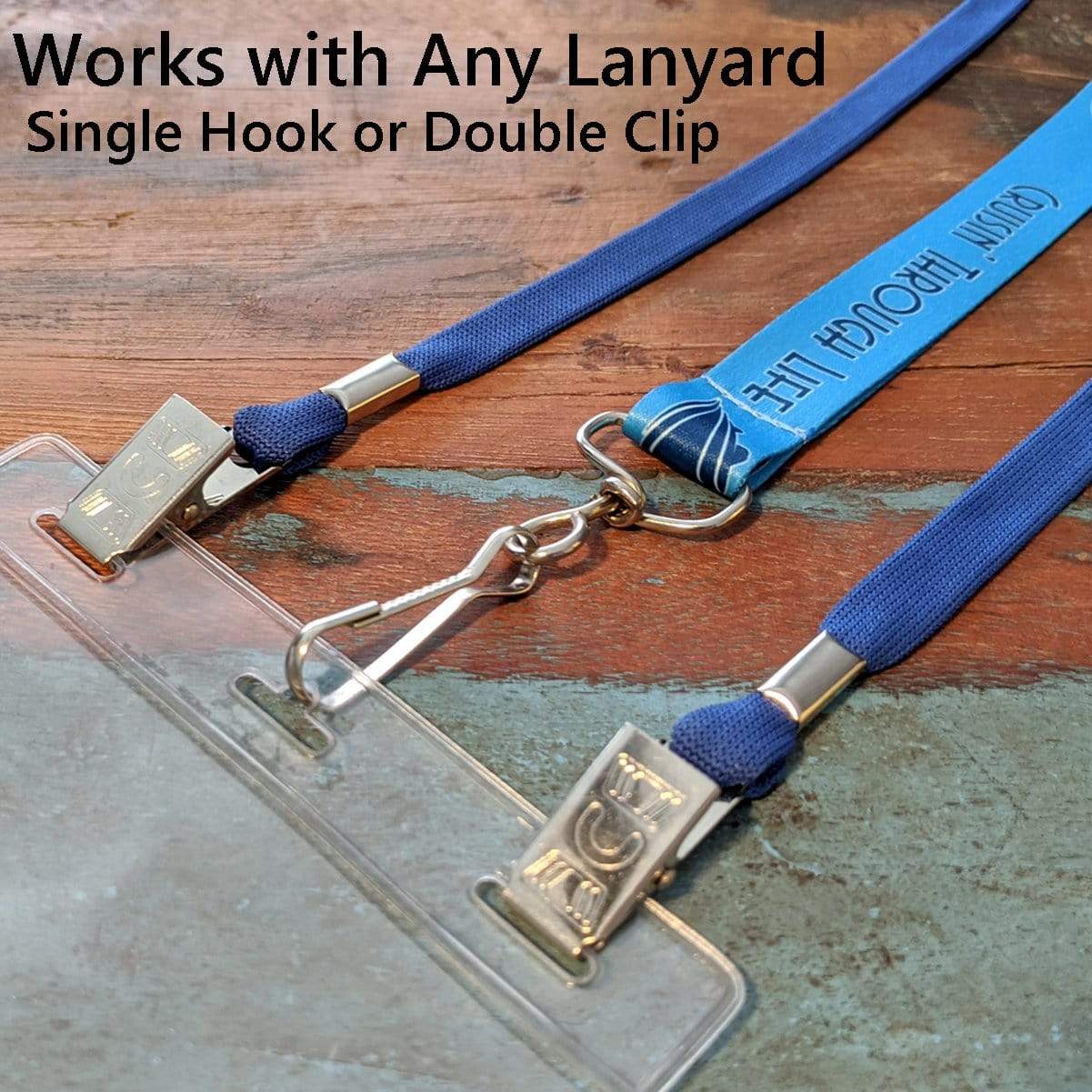 A Vertical Oversized 4X6 Vinyl ID Badge Holder (XL46V) is compatible with single hook and double clip lanyards, as shown with two blue lanyards attached.