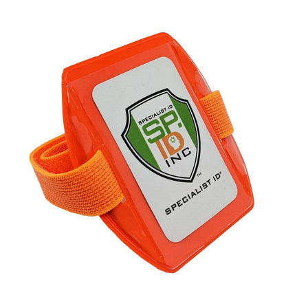 The Vertical Reflective Armband ID Holder (R504-ARN), featuring an adjustable strap and a clear plastic ID holder, proudly displays the logo and name "Specialist ID Inc.